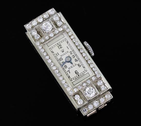 A ladys 1930s 18ct white gold and diamond set Rolex manual wind cocktail watch, length 30mm.